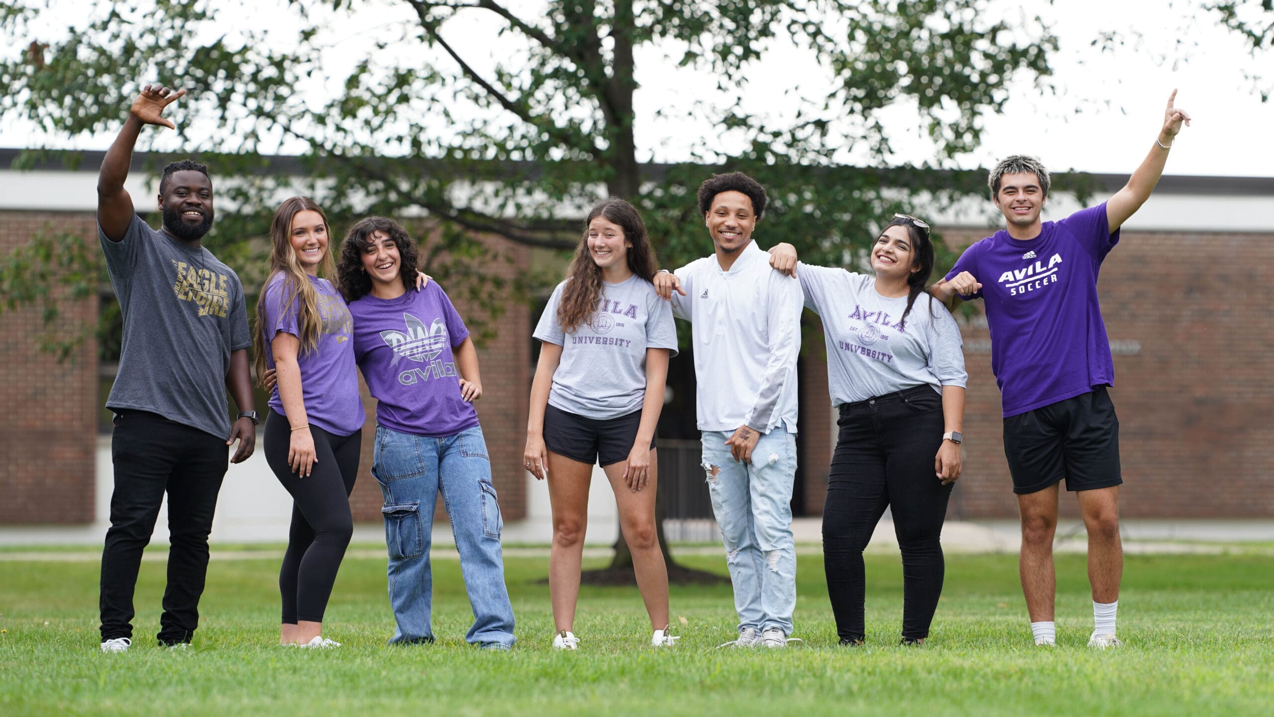 A student aviator posing with fellow aviators