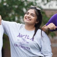 A student aviator posing with fellow aviators