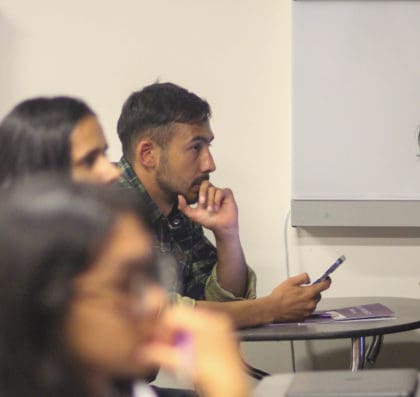 a group of people paying close attention to the lesson