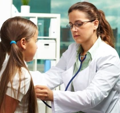 physician examining a girl
